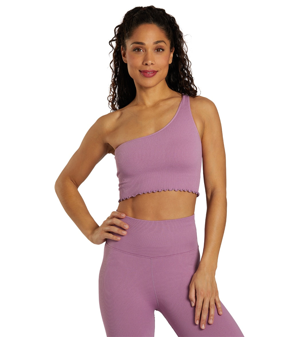 off shoulder bodysuit in amethyst purple worn in yoga studio
