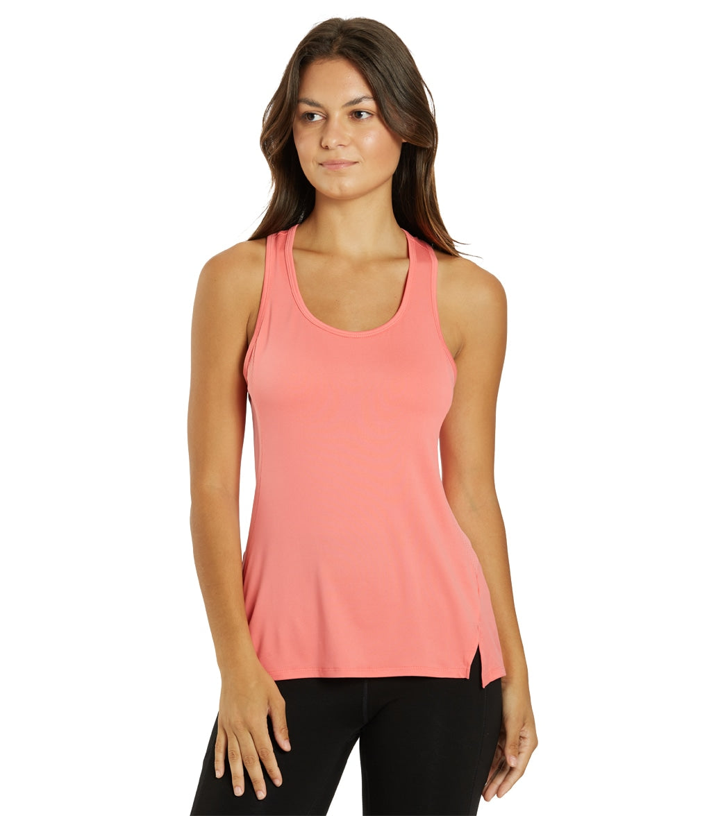 halter one piece paired with amara tank sunkissed coral