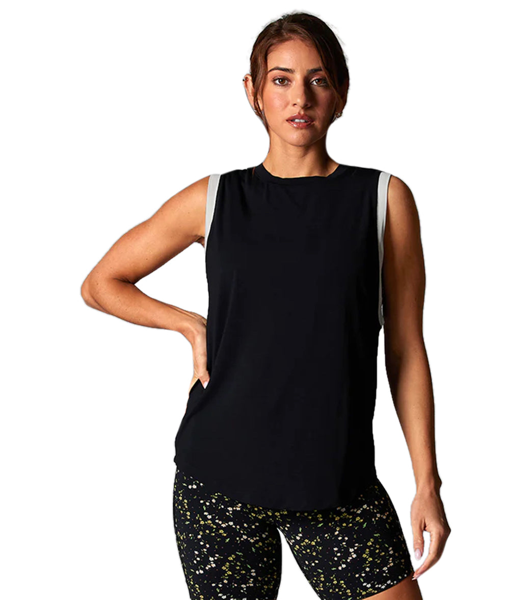 halter neck bathers layered under high neck muscle tank